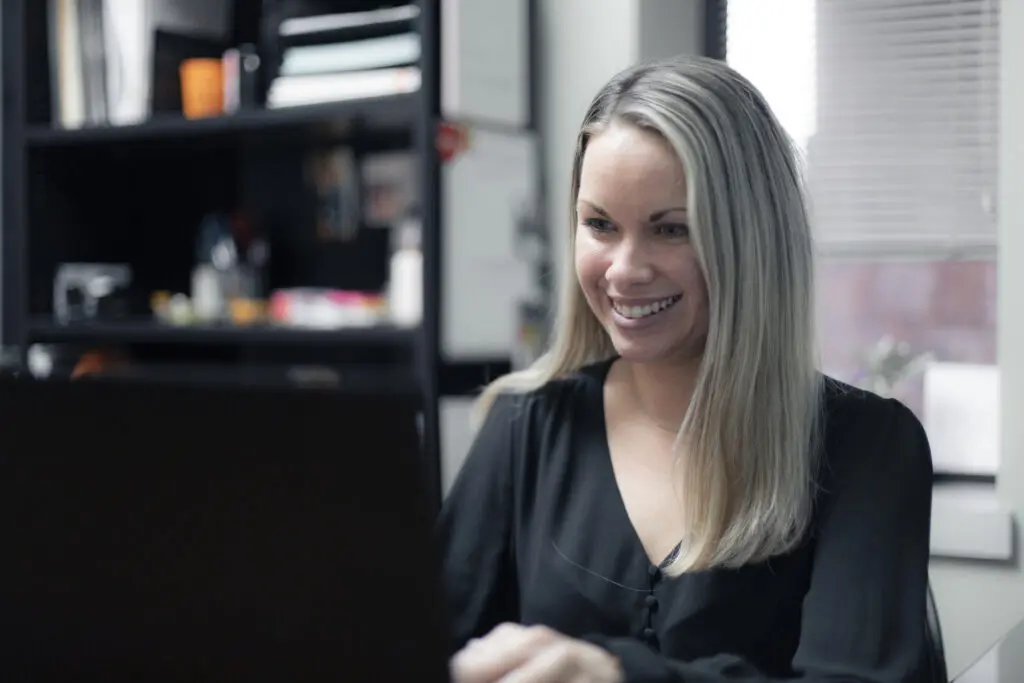 Adrienne at desk working