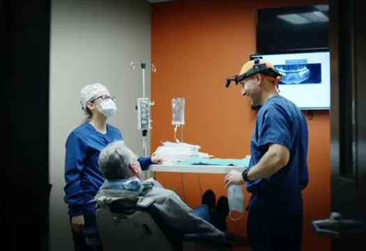 Doctor and staff with patient