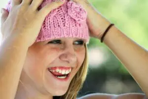 https://pixabay.com/photos/girl-bonnet-portrait-happy-204327/ Young girl in pink hat smiling